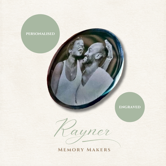 Round engraved photo coin with a couple's photo, branded 'Rayner Memory Makers'.