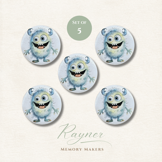 Set of 5 cartoon monster buttons with a 'Rayner Memory Makers' label on a light background