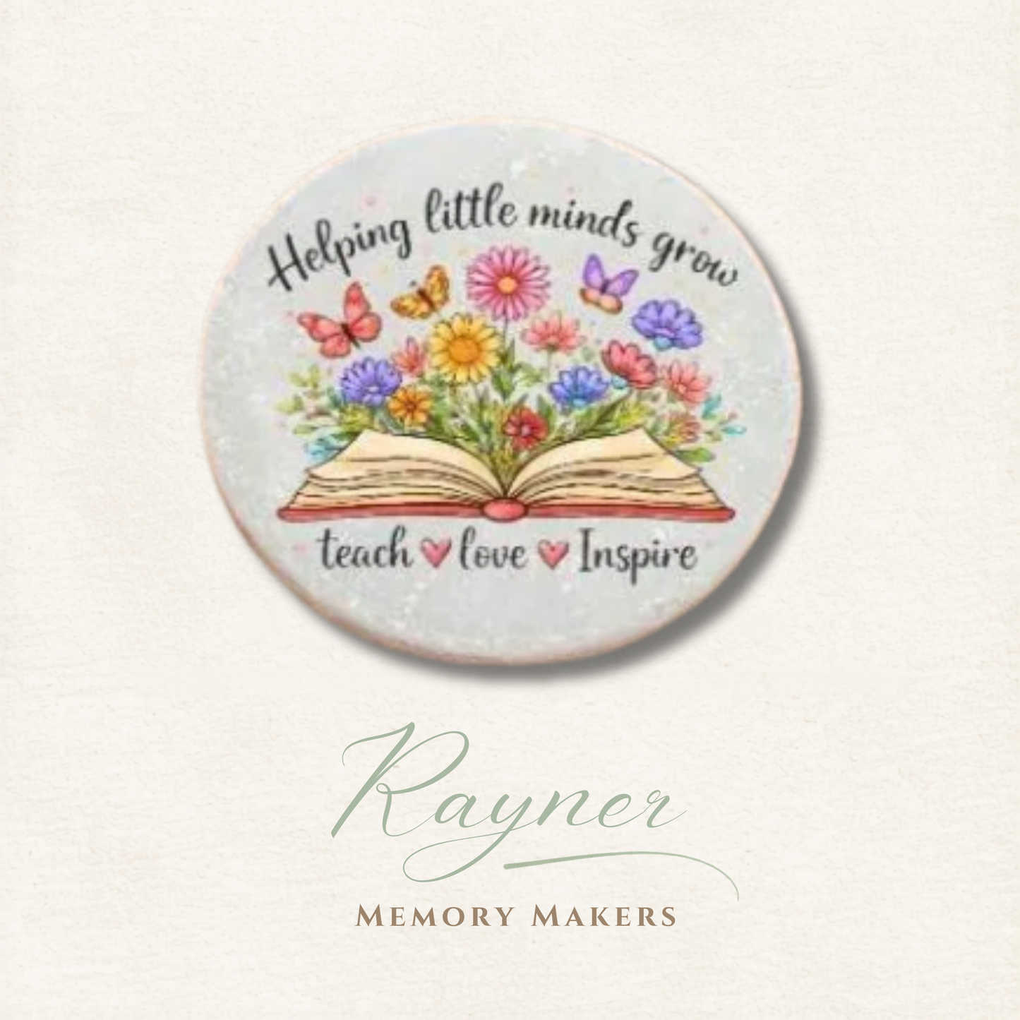 Round ceramic coaster with floral design and text 'Helping little minds grow, teach, love, Inspire' on a light background.